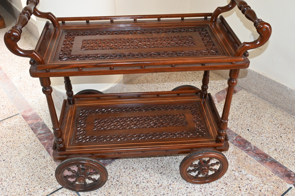 Wooden tea trolley with cut work